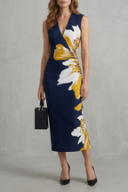 Veloura – Kühner floraler Kontrast – Midikleid